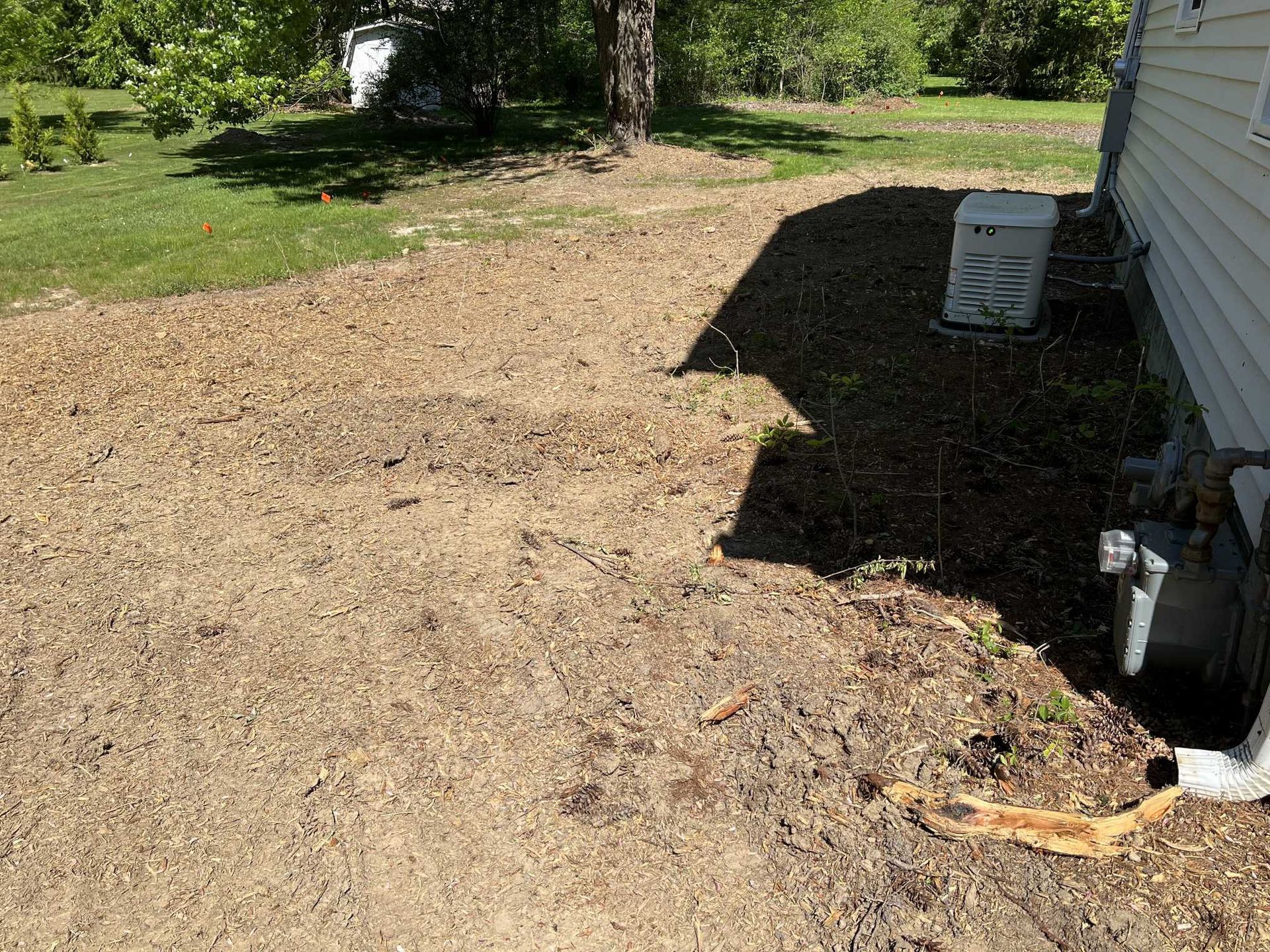 A house with a lot of dirt in front of it.