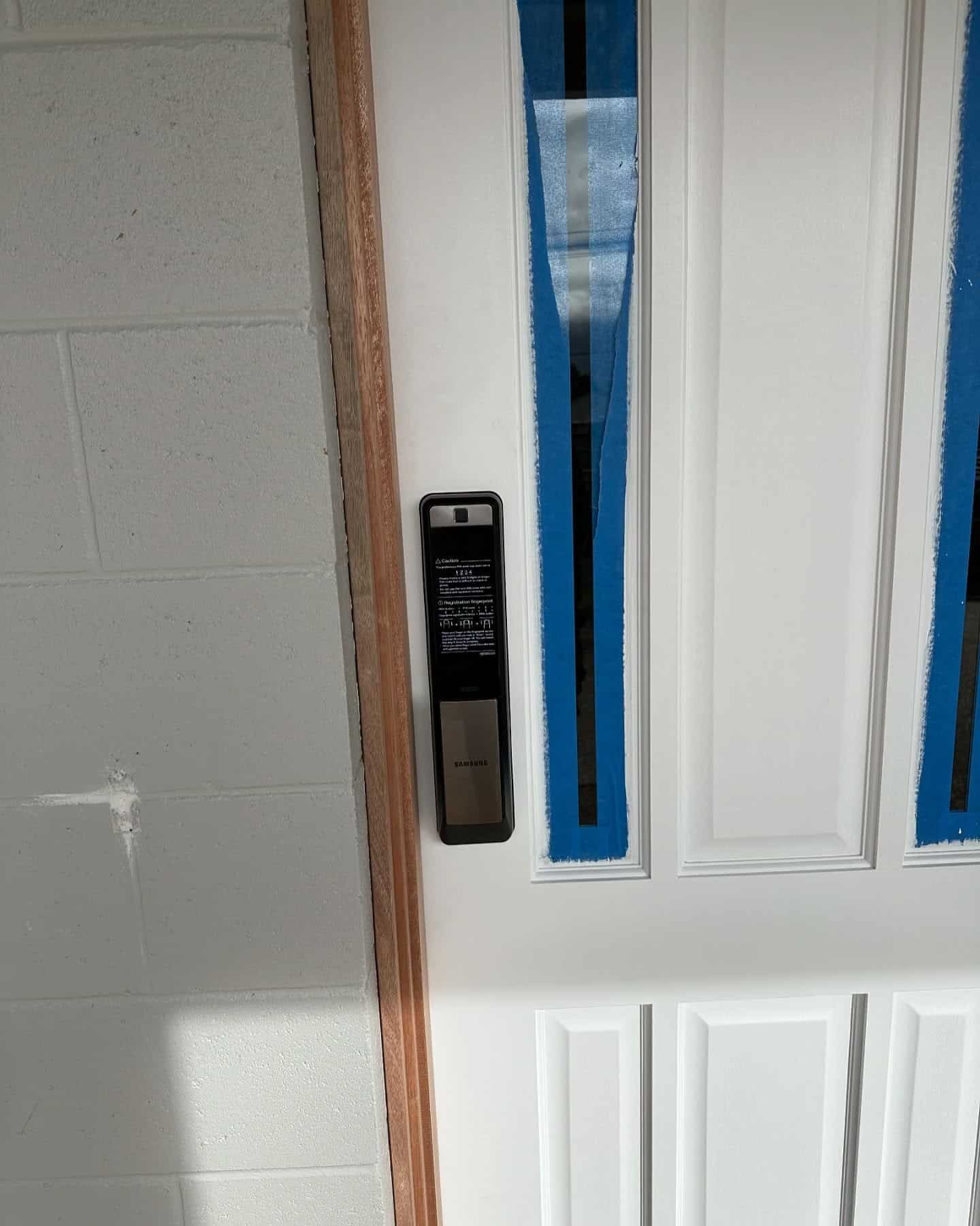 White Door With Black Keypad Lock — Great Ocean Locksmiths in Belmont, VIC