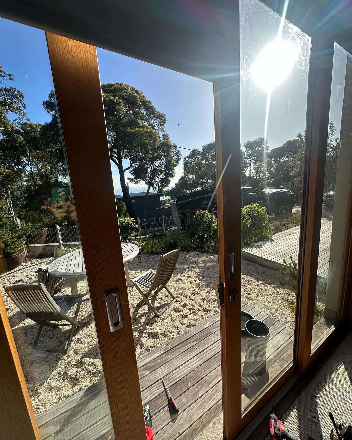 Glass Sliding Doors Open to a Sunlit Backyard With Trees — Great Ocean Locksmiths in Belmont, VIC