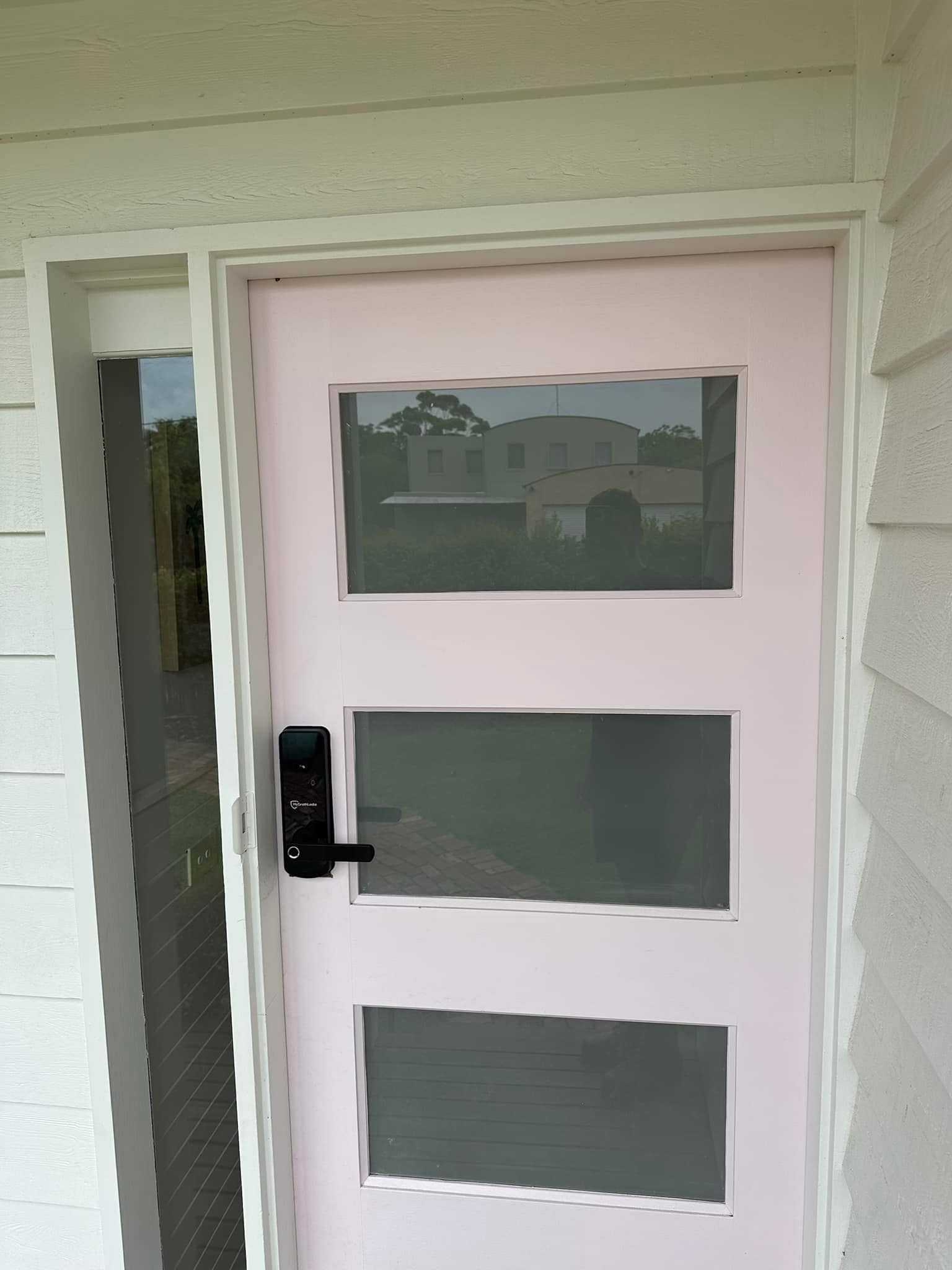 Pink Front Door With Three Rectangular Windows, Black Handle, White Trim — Great Ocean Locksmiths in Aireys Inlet, VIC