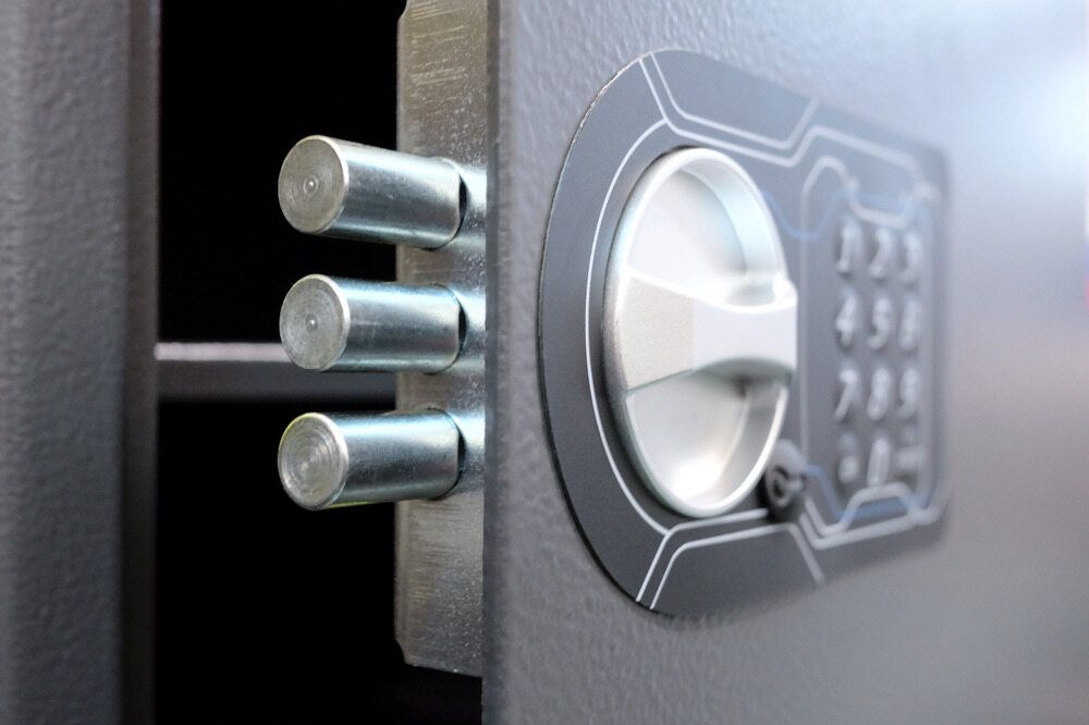 Close-up of a Grey Safe Door, Showing Three Silver Locking Bolts — Great Ocean Locksmiths in Belmont, VIC