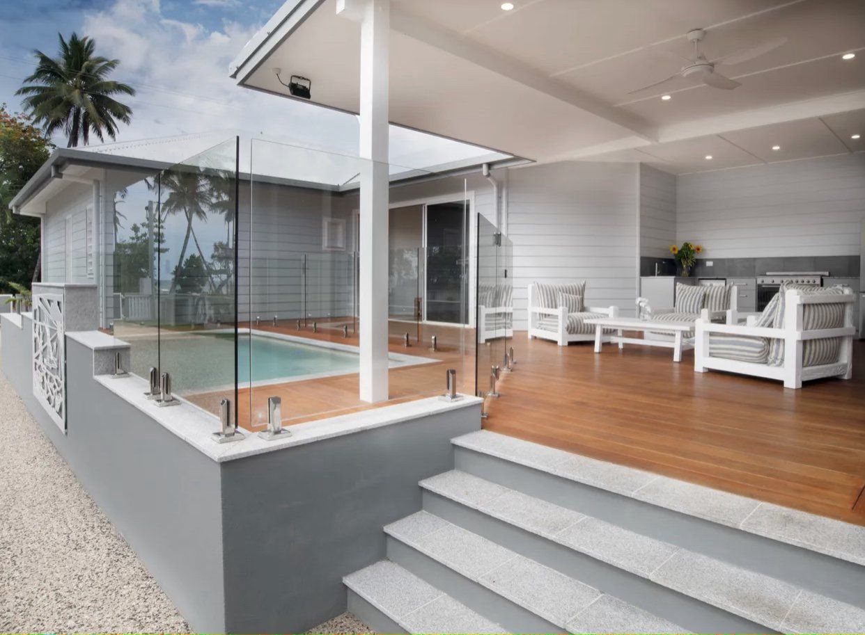 A house with a swimming pool and stairs leading to it