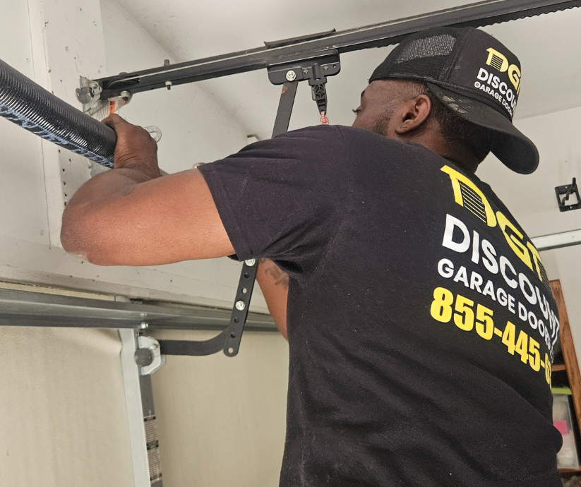 tech repairing garage door spring in dallas pa