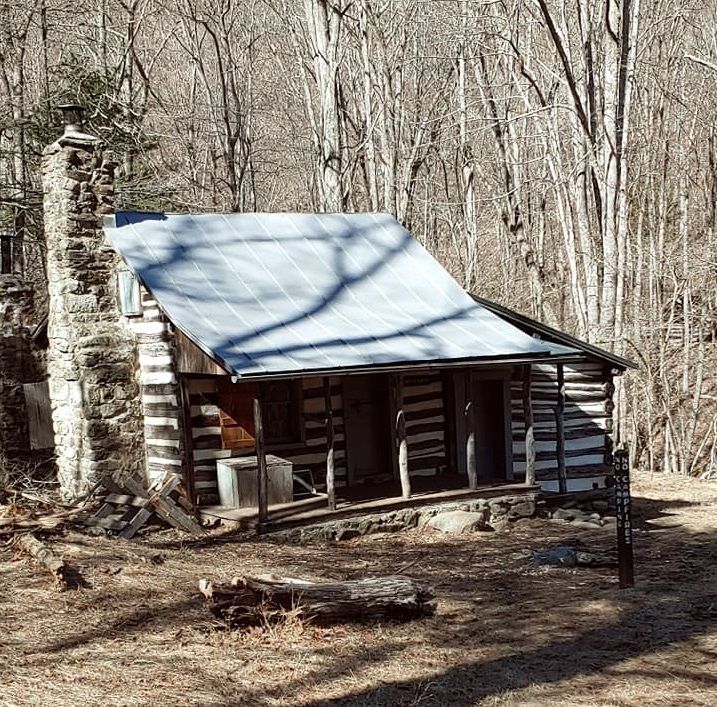 The rear of the Corbin cabin shows a small porch.