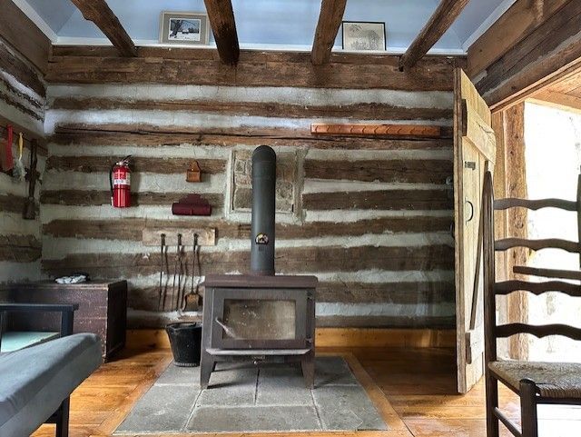 a rustic looking kitchen with wooden cabinets and countertops 