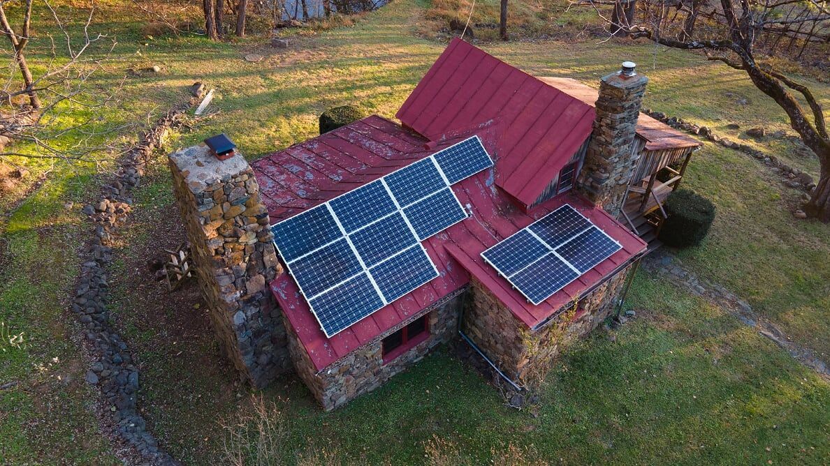 An aerial view of Vining cabin showing solar panels, used as renewable energy.