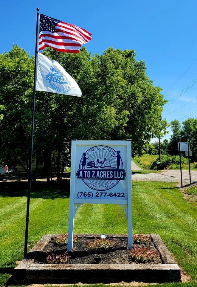A to Z Acres sign and USA Flag in Waynesville, Ohio.