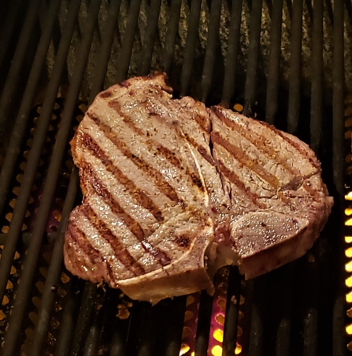 Steak sizzling on the grill