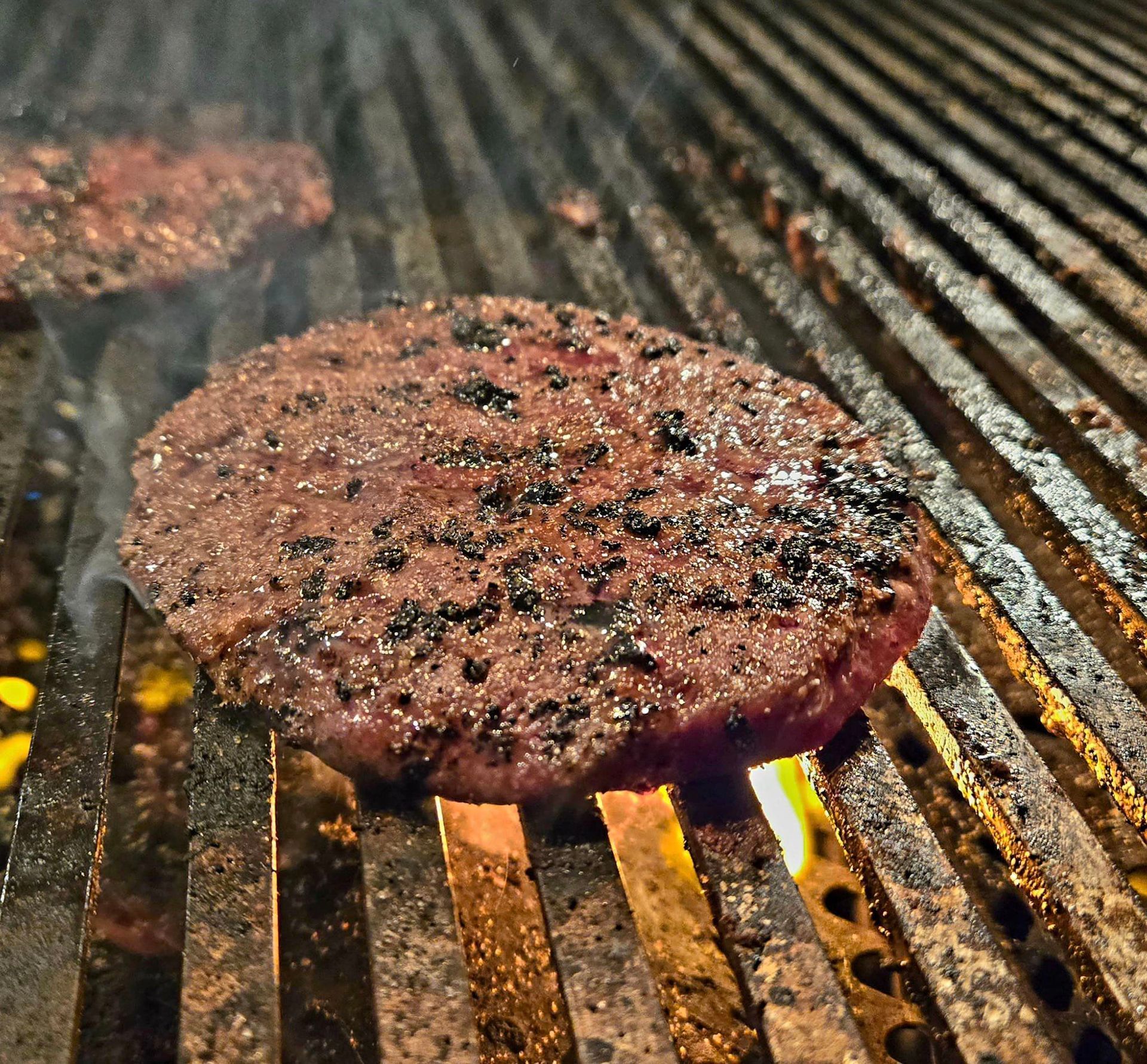 Ground Beef Hamburgers sizzling on the grill