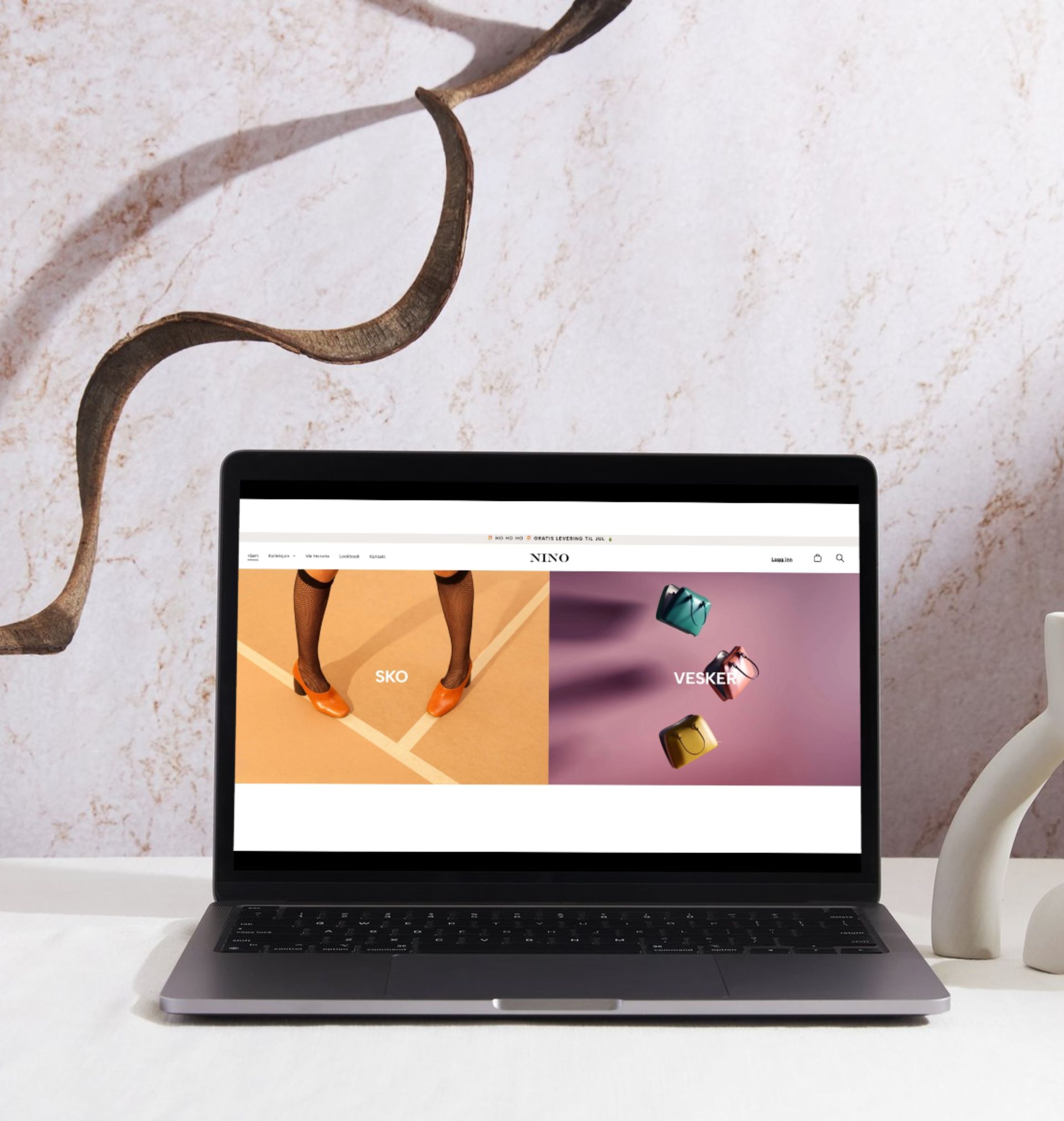 A laptop is open to a page that says nespresso