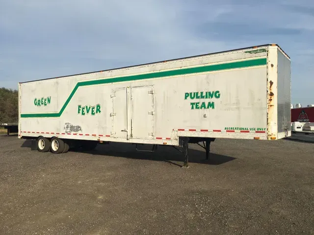White semi-trailer with green 