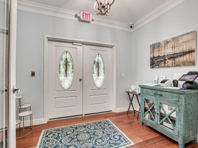 There is an exit sign above the door in the hallway.