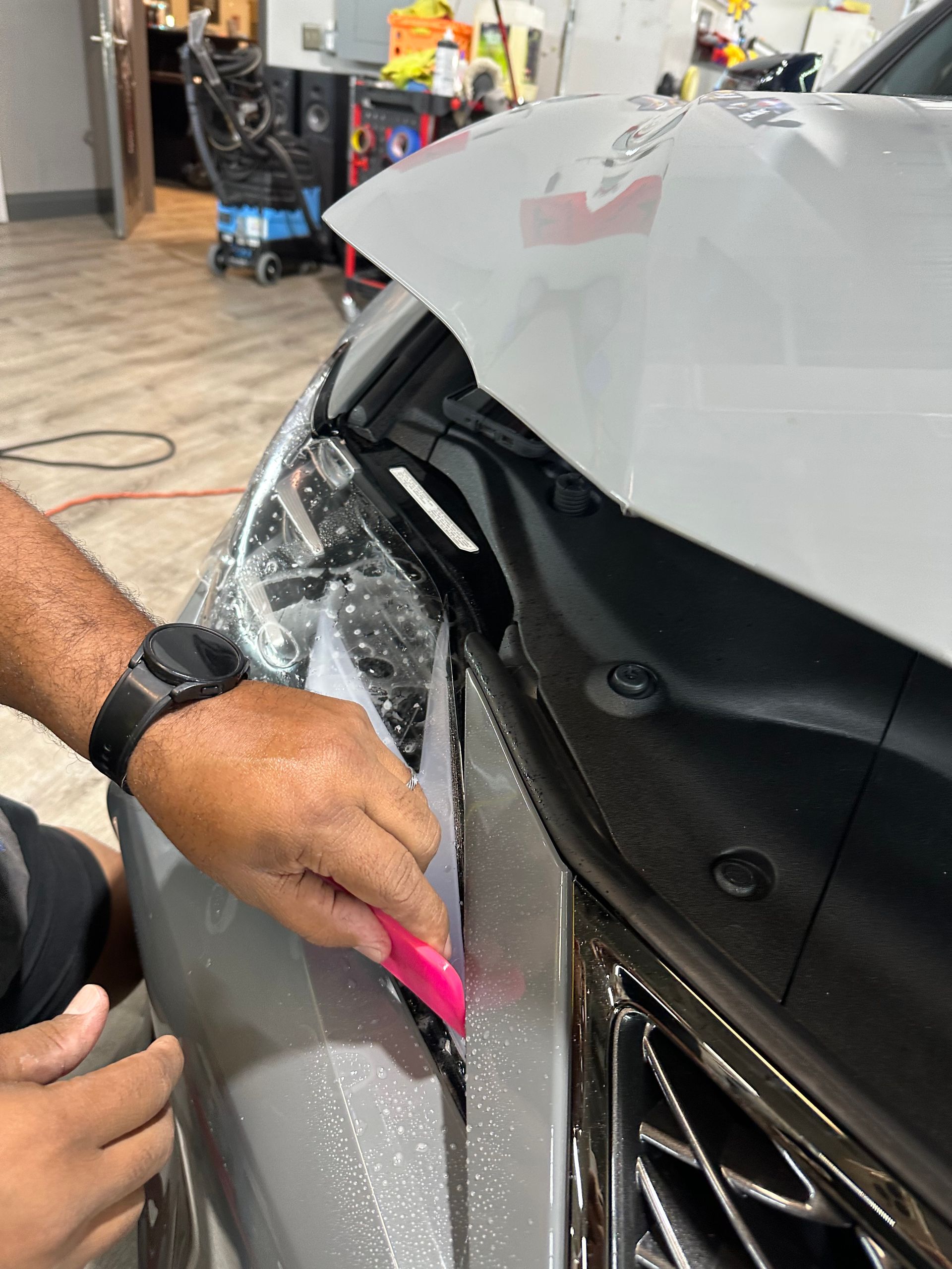 Installing a Protective Film on a Car — Fort Myers, FL — Qool Window Tinting