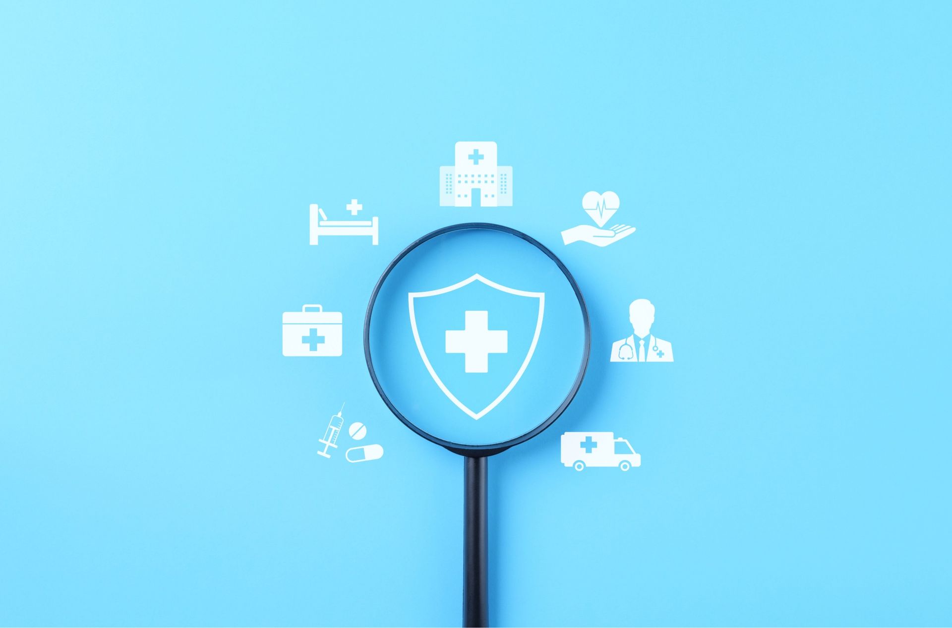 Magnifying glass over a shield with a medical cross, surrounded by health icons on blue.