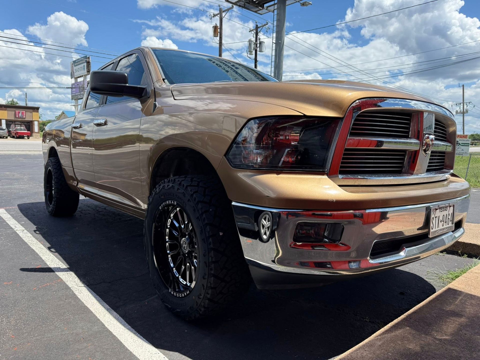 A dodge ram truck is parked in a parking lot.