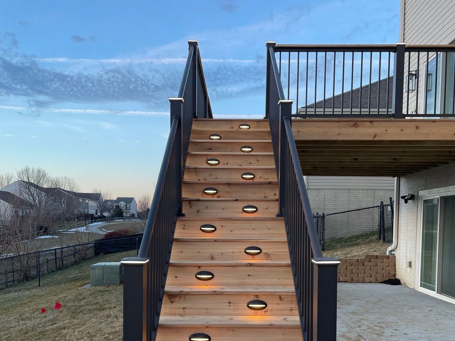 A wooden deck with stairs leading up to it.