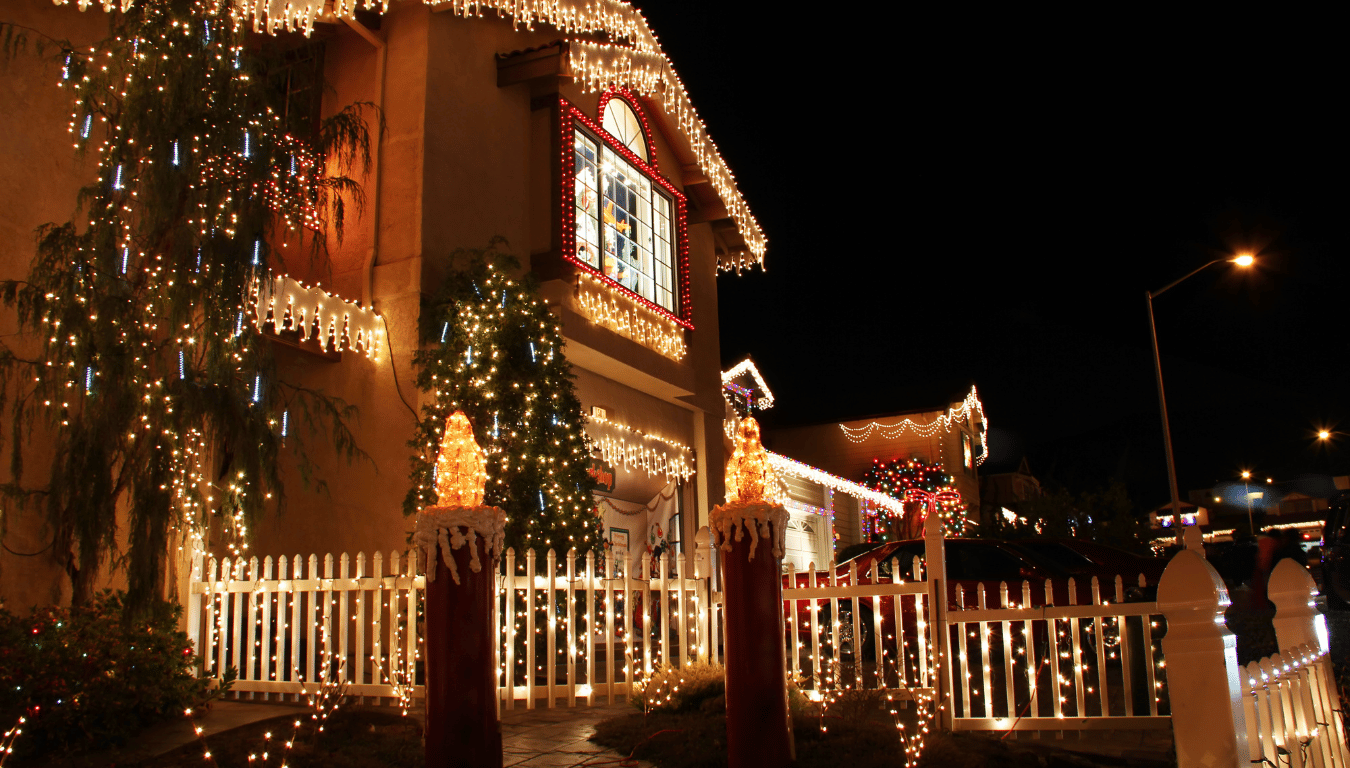 a house is decorated with christmas lights at night