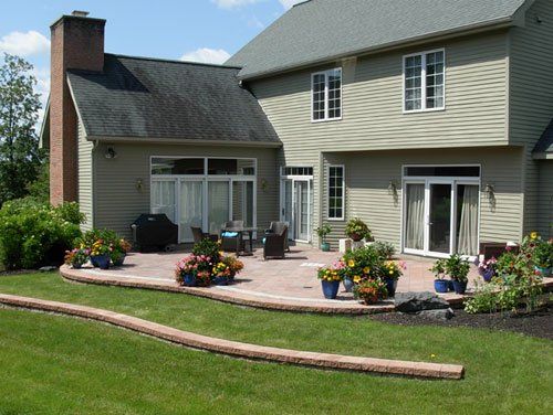 A Home in Syracuse, NY with a custom designed backyard patio