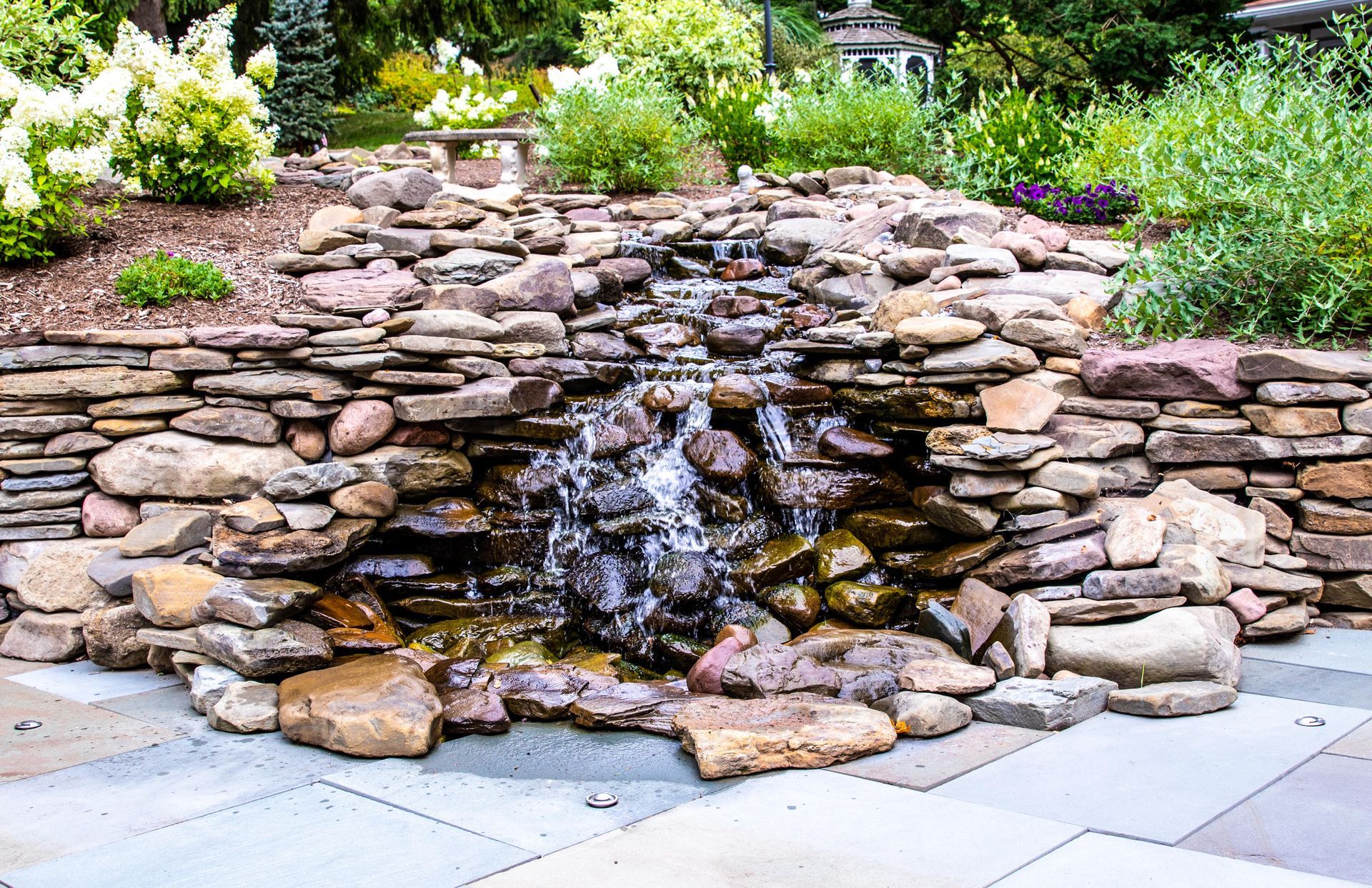 Beautiful natural stone retaining wall and fountain feature