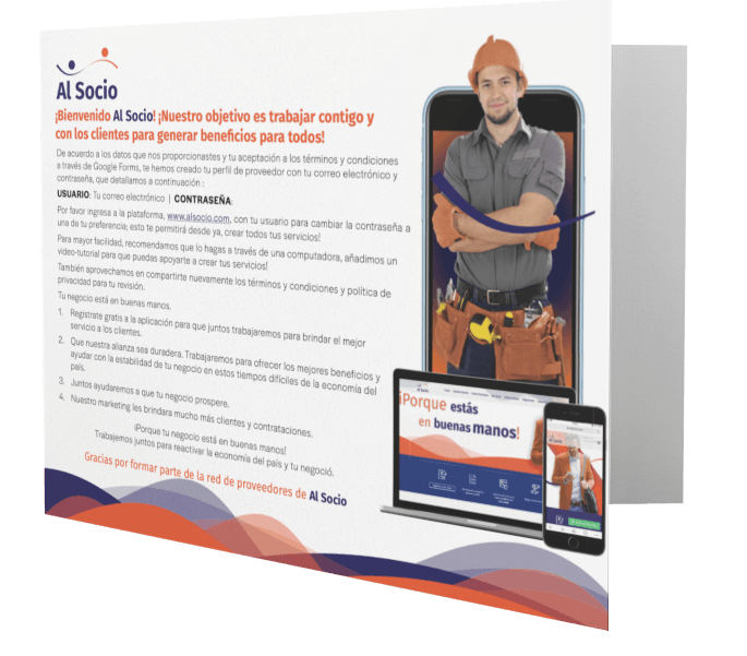 A man in a hard hat is standing in front of a laptop and phone.