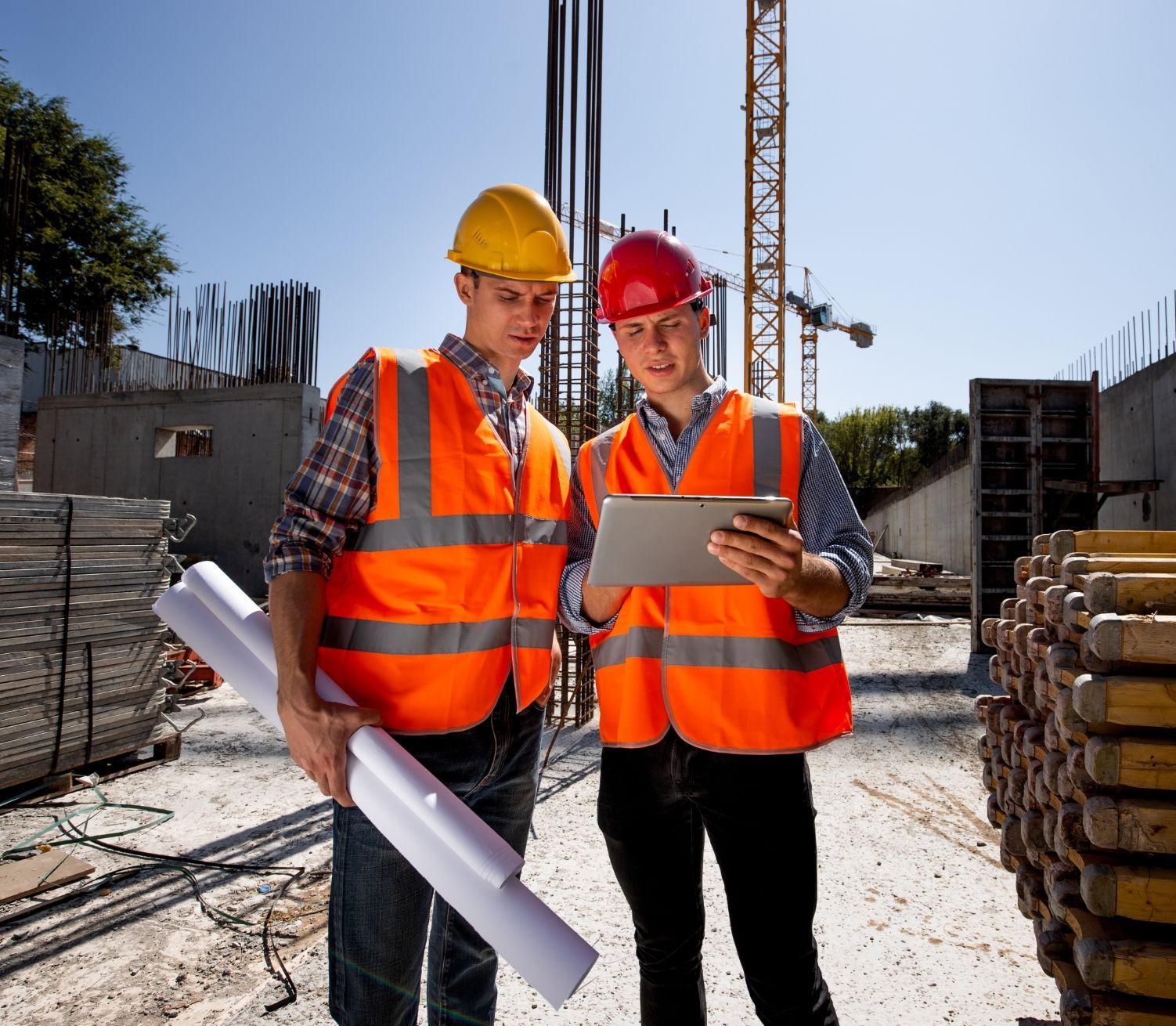 Two Engineers inspecting a construction using modern IFS ERP Systems