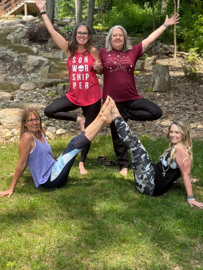 Outdoor yoga community practicing together in a peaceful park setting