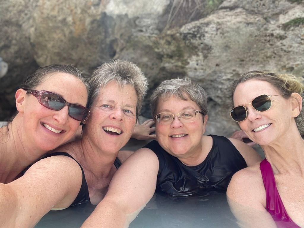 Group of happy yogis smiling and laughing after a joyful yoga class