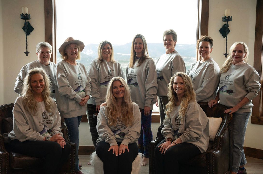 Worthy and Wyld yoga community gathering smiling after a group class