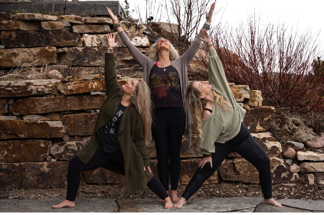 Yogis showing friendship and support during a group yoga retreat