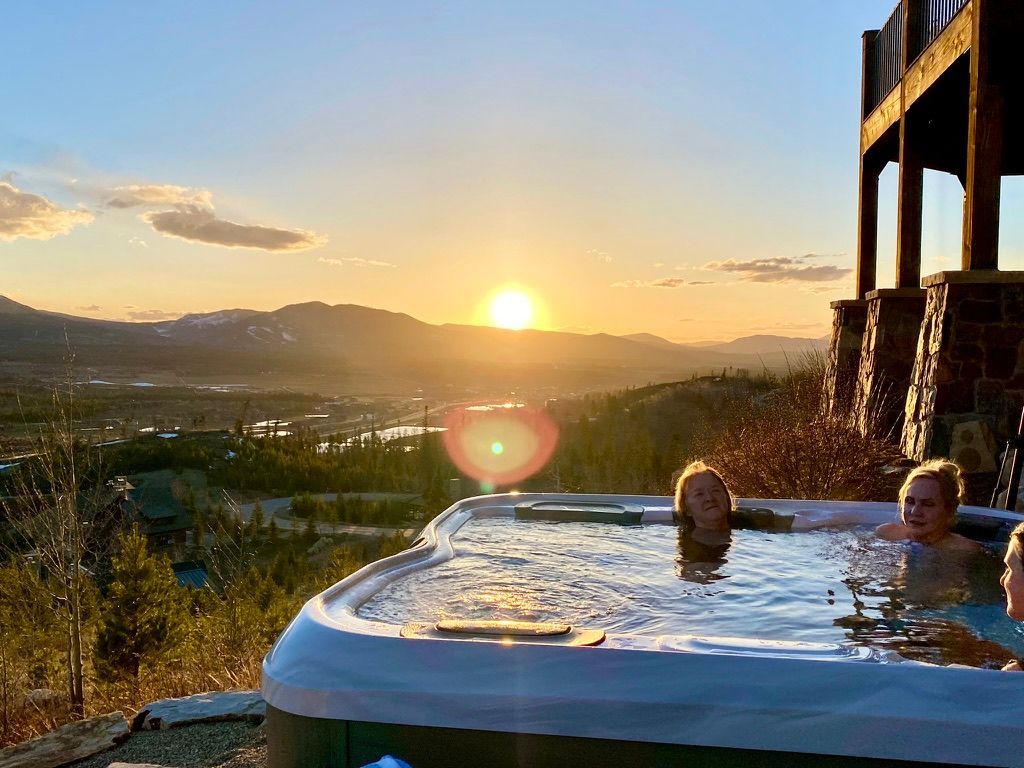 Happy group of diverse yogis gathered outdoors after a sunset yoga session