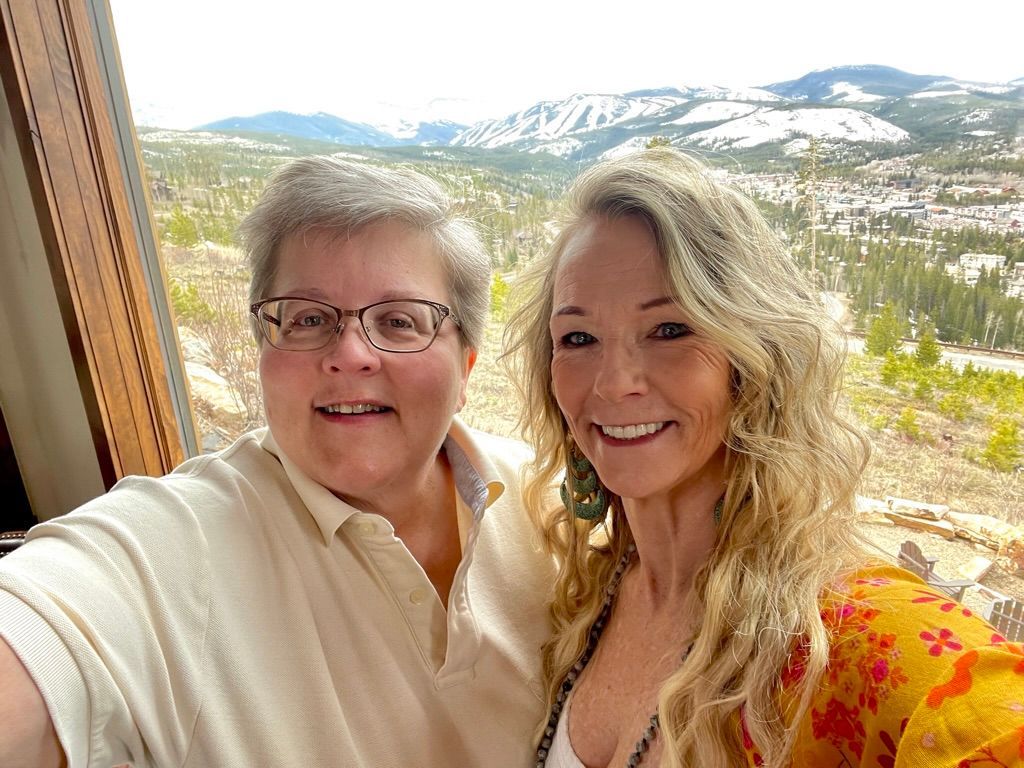 Smiling yoga community members celebrating progress and connection