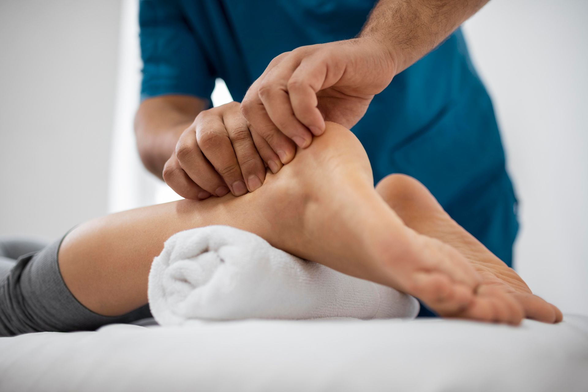 A man is giving a foot massage to a woman.