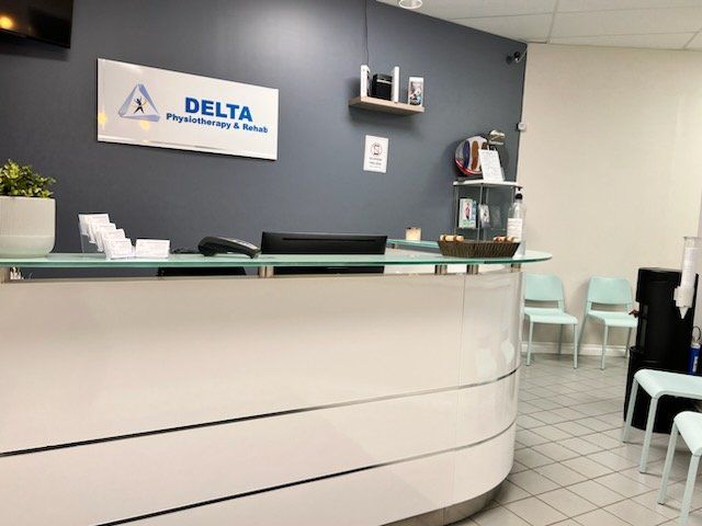 A delta sign hangs above a desk in a waiting room