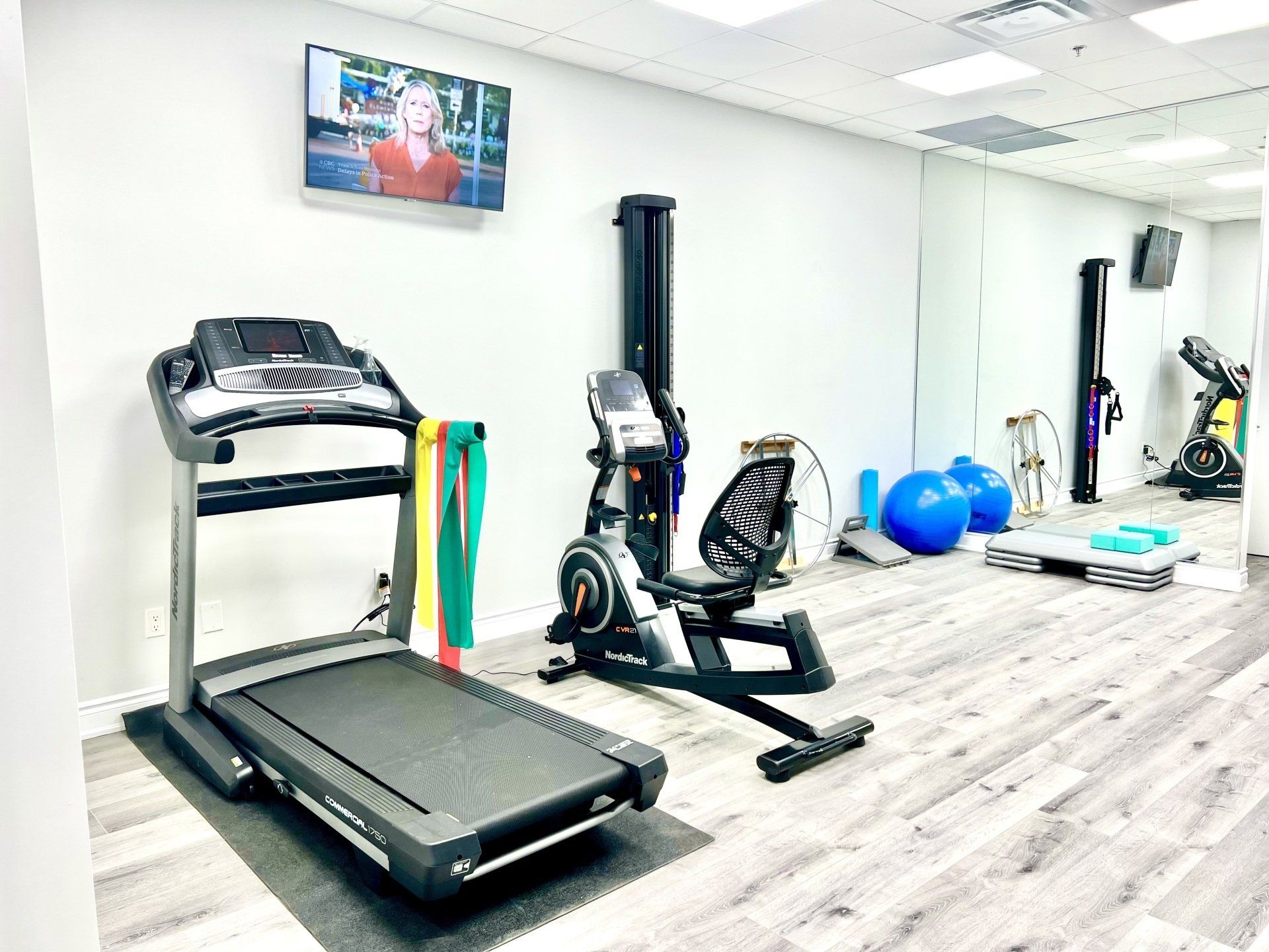 There is a treadmill in the middle of the room.