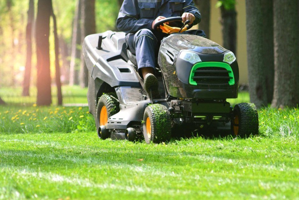 man on lawn mower