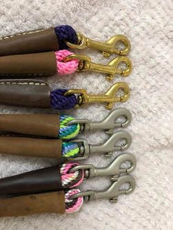 A bunch of colorful ropes are sitting on top of each other on a table.