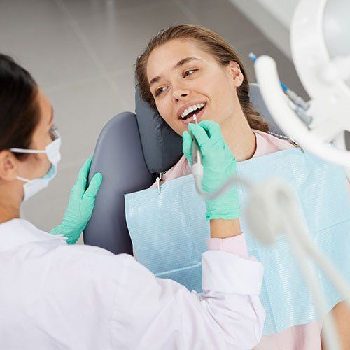 Dentist Cleaning Woman's Teeth — Leominster, MA — Lanza Dental Office