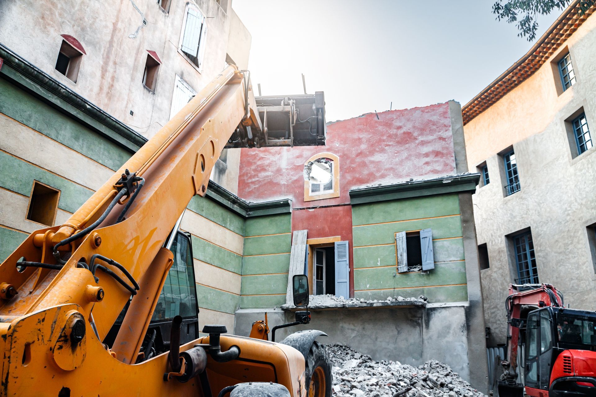A bulldozer is being used to demolish a building