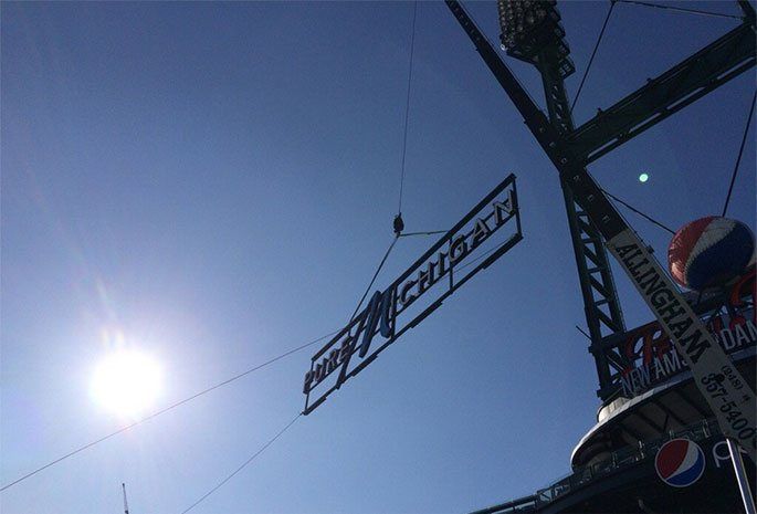 A ferris wheel with a sign that says happy celebration