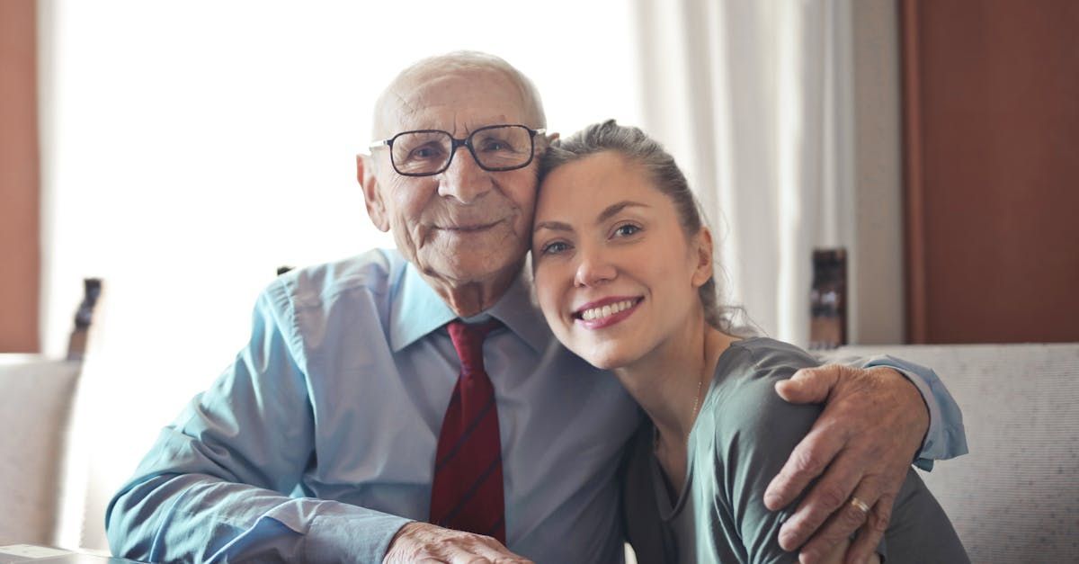 Image of an older gentleman and a woman hugging