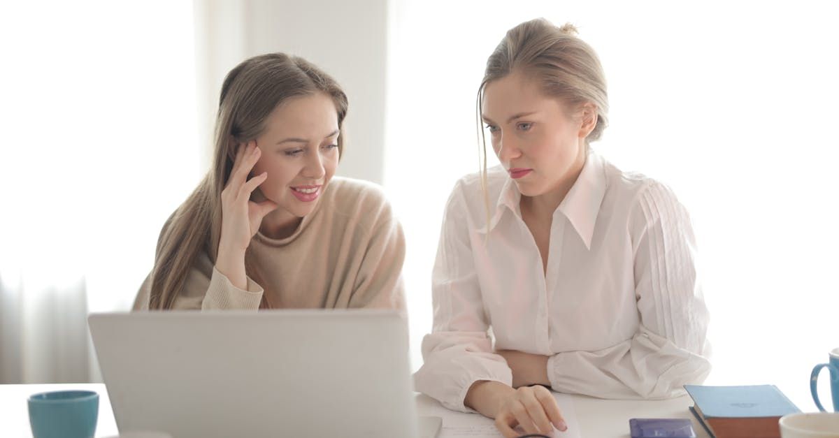 Image of two women at a computer discussing an estate plan