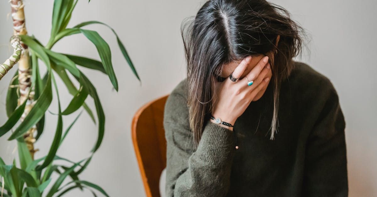 Image of woman holding her face in her hands in frustration, click image to read blog post