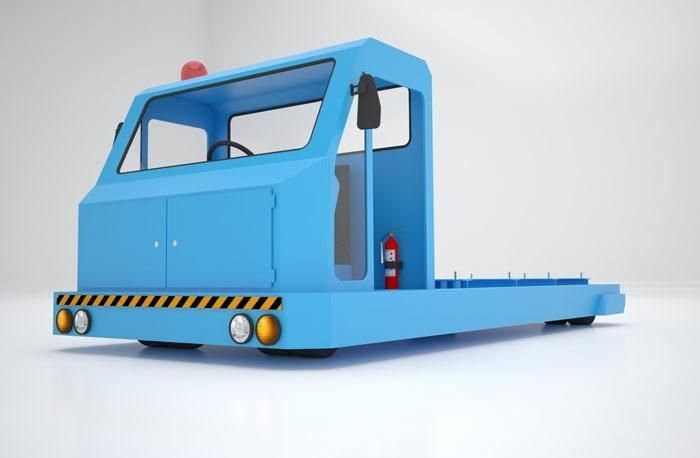 Un camión azul con un extintor rojo en la parte trasera.