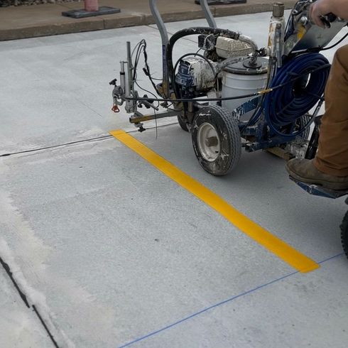 Parking Lot Striping Machine Laying down lines on concrete in San Francisco