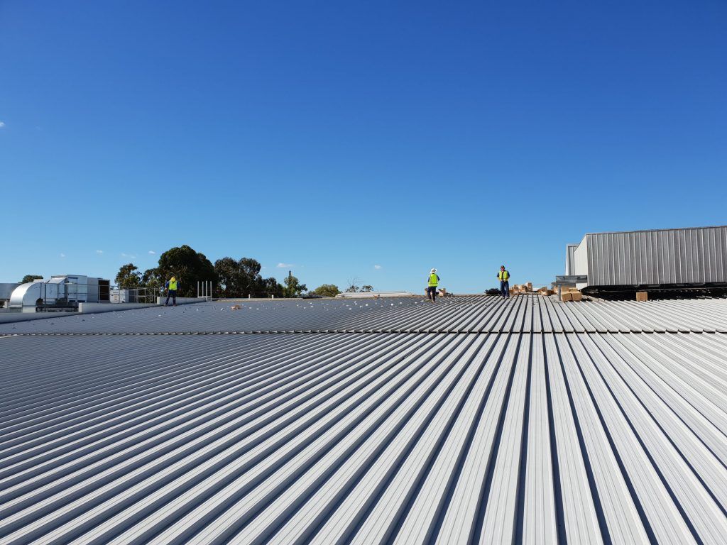A White Roof With a Blue Sky in the Background — Sapphire City Solar & Electrical In Inverell, NSW