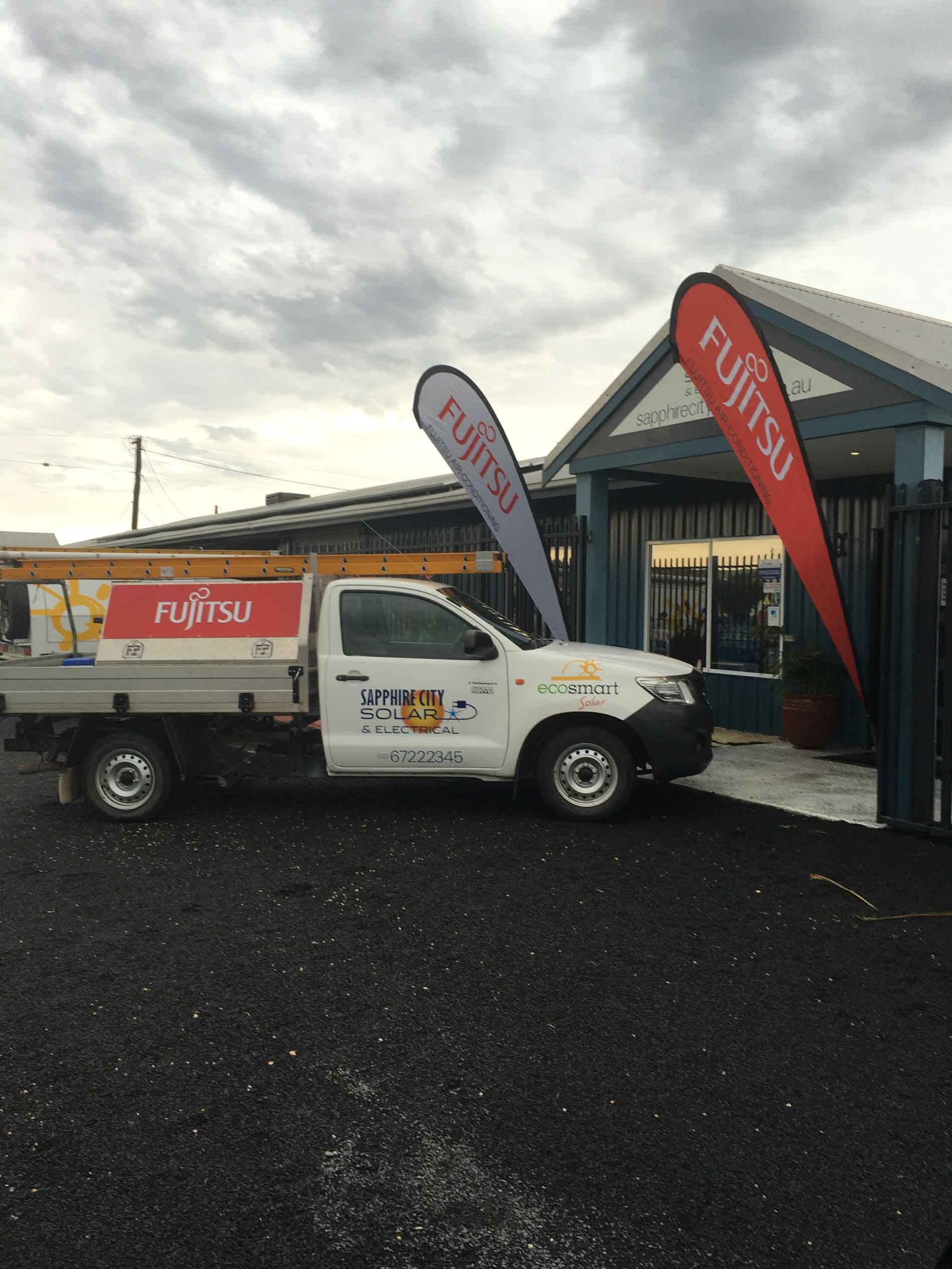 A Fujitsu Truck is Parked in Front of a Building β Sapphire City Solar & Electrical In Inverell, NSW