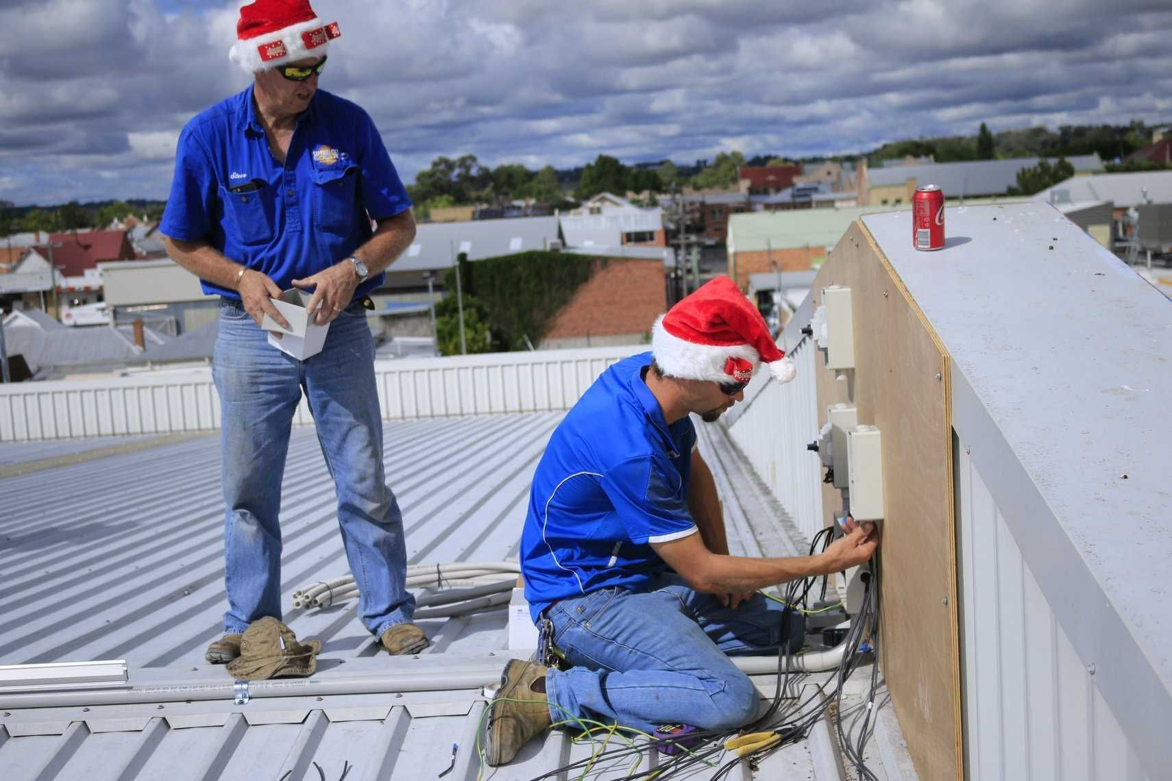 Two Men  Are Working on a Roof β Sapphire City Solar & Electrical In Inverell, NSW