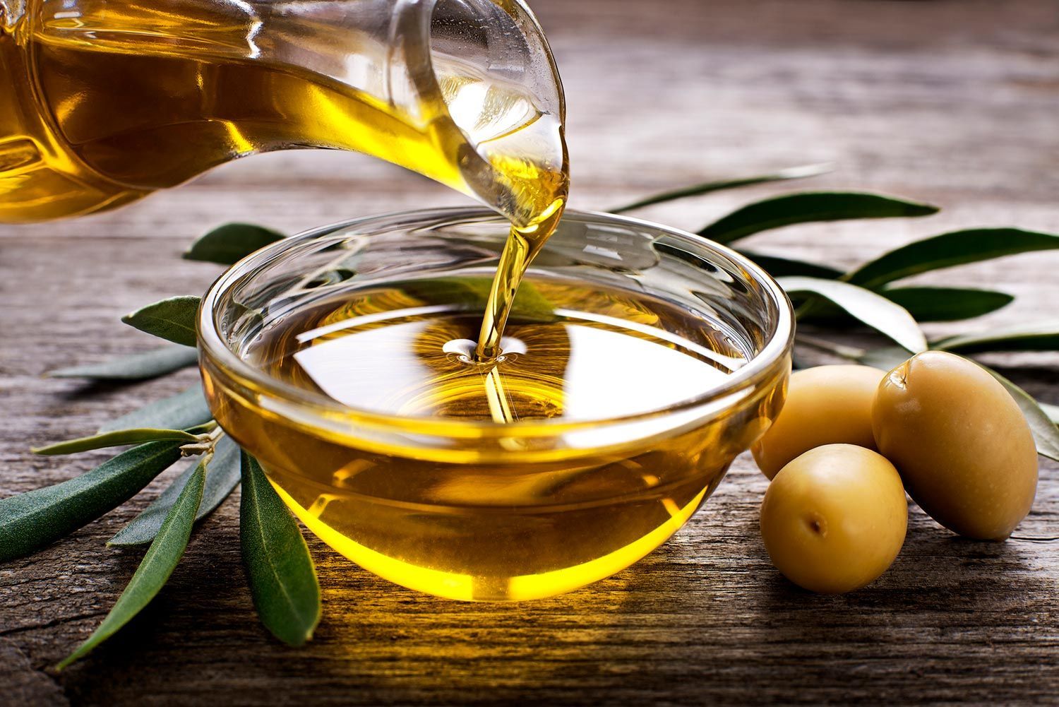 Pouring Olive Oil — Troy, MI — Picano’s Italian Grille