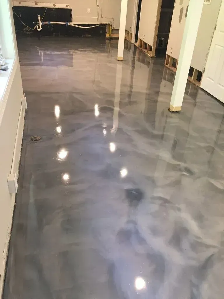 Metallic gray epoxy flooring in a basement.