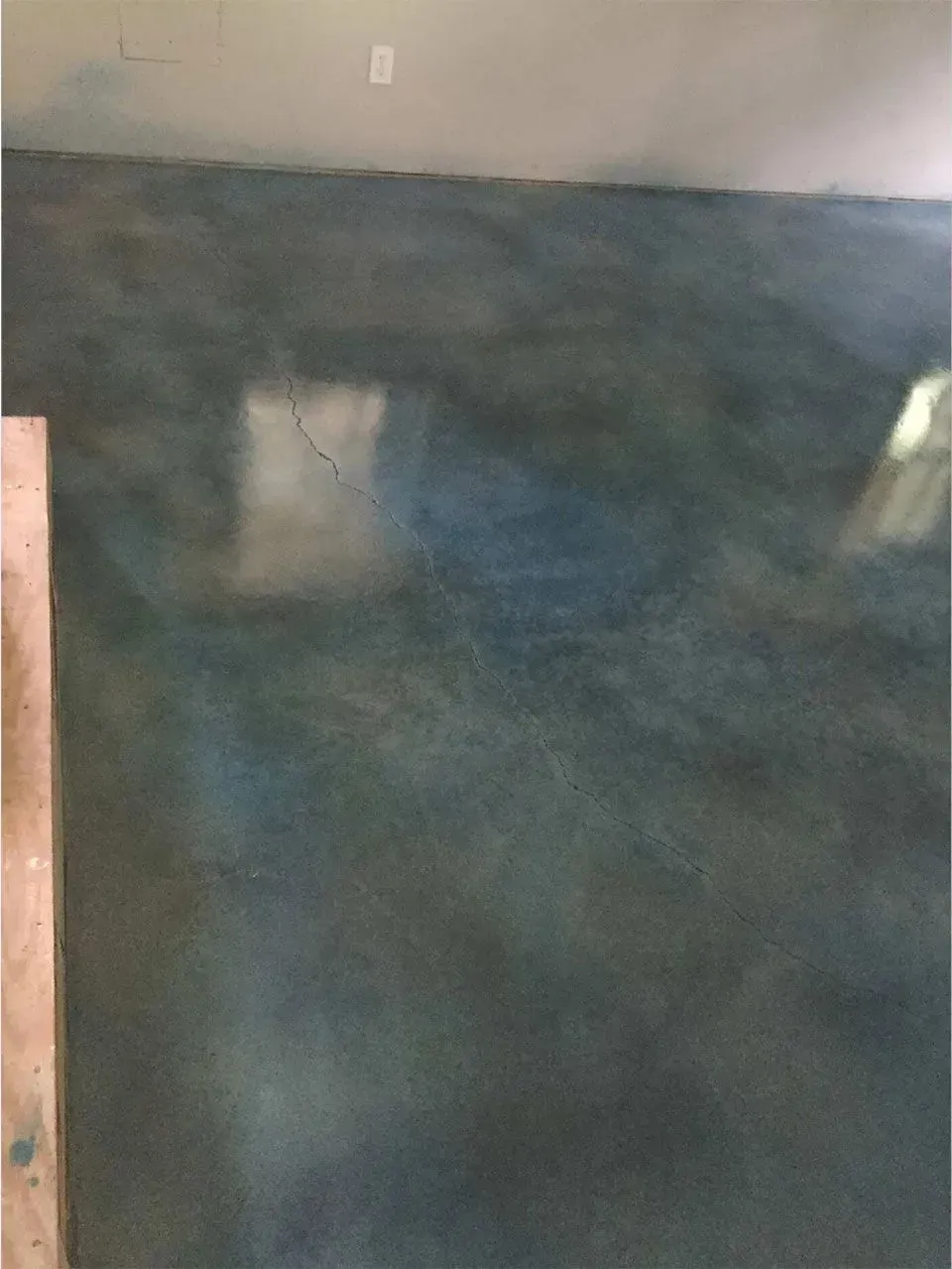 Blue and green painted concrete wall.